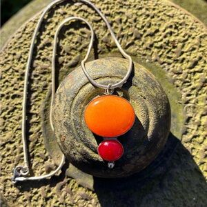 Hand-cut glass duo necklace.